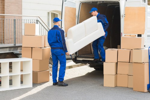 Commercial movers preparing office furniture and equipment for transport in Hillingdon