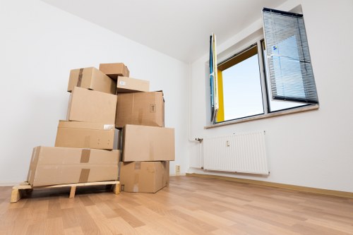 Packed moving boxes and furniture prepared for truck hire in Hillingdon
